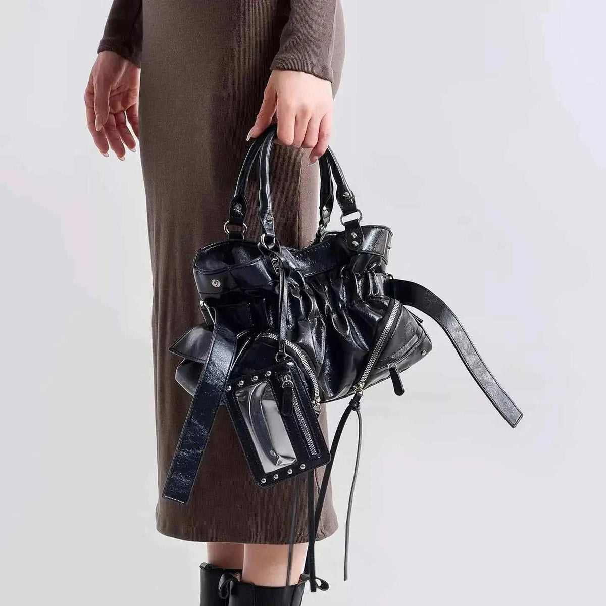 Ruched Leather Crossbody Bag in black PU leather with shiny finish, ruched detailing, dual handles, and detachable strap