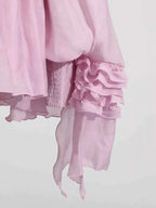 Ruffled Long Sleeve Mini Dress in soft pink polyester featuring tiered ruffle detailing on the sleeve cuff and a lightweight flowy texture