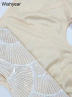 Cream sequin hollow out fabric with white geometric sequin pattern on beige polyester material