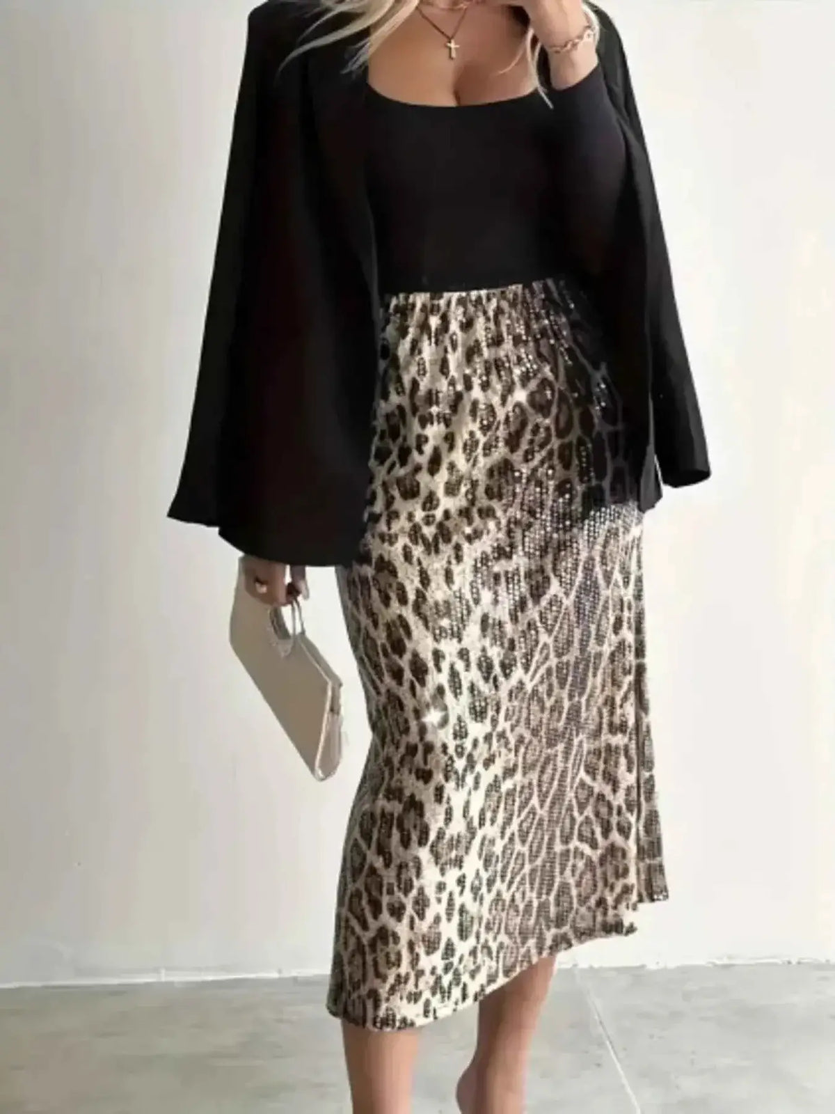 Sequin Leopard Midi Skirt in beige and brown leopard print with shiny sequins, worn with a black top and blazer