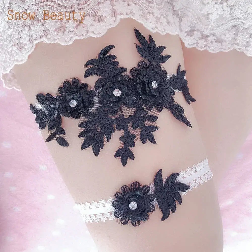 Black lace garter belt with floral applique and crystal details paired with white lace elastic band featuring a black flower applique,Sexy Lace Flower