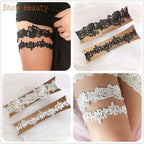 Two pairs of Sexy Lace Flower garter belts in black and white lace with floral patterns worn on thighs