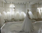 Short Wedding Dress collection featuring various white, voluminous ball gowns and a mannequin wearing a sparkling gown with a long train