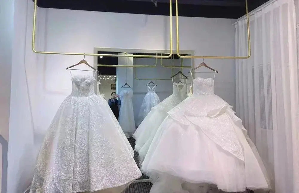 Short Wedding Dress white strapless ball gown with glittery floral pattern and voluminous skirt on hanger