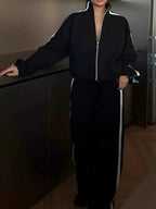 Black Side Stripes Zip Up Top with white stripes on sleeves and matching pants featuring white side stripes and zipper