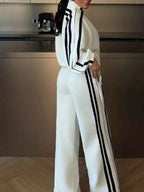 Side Stripes Zip Up Top and pants set in white with black double stripes on sleeves and pant legs, featuring a zip closure and contrasting stitching