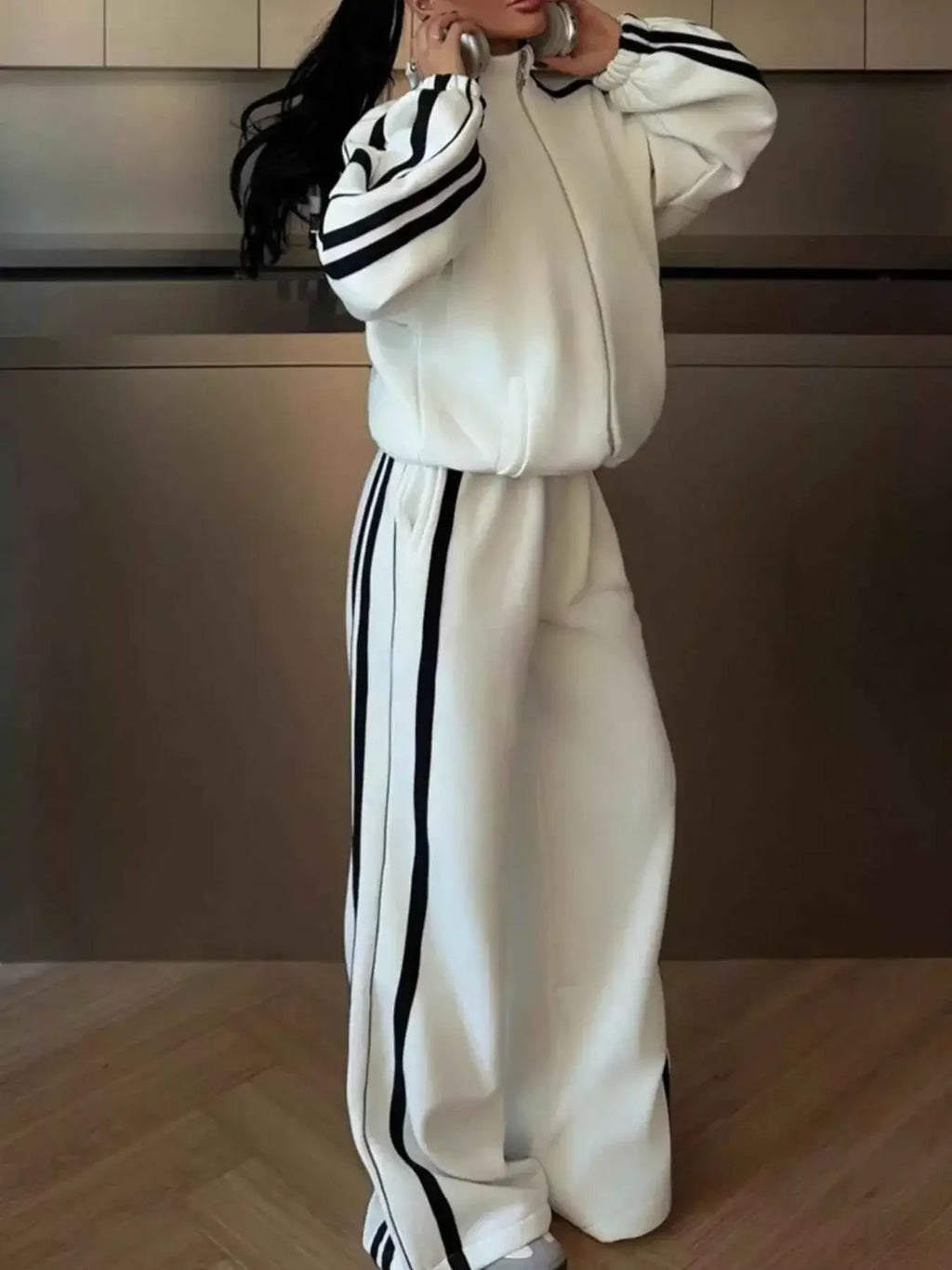 White two-piece lounge set with black side stripes and zipper, featuring moderate stretch and contrast stitching, Side Stripes Zip Up Top included