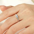 Silver-Plated Minimalist Ring featuring a silver-plated band with a single square-cut clear zircon stone centerpiece on a hand