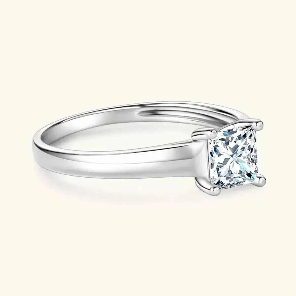 Silver-Plated Minimalist Ring with a shiny silver band and a large square-cut clear zircon stone in a four-prong setting.