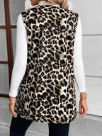 Sleeveless Leopard Print Vest in beige, black, and brown with a pocketed design and normal thickness worn over a white long-sleeve top