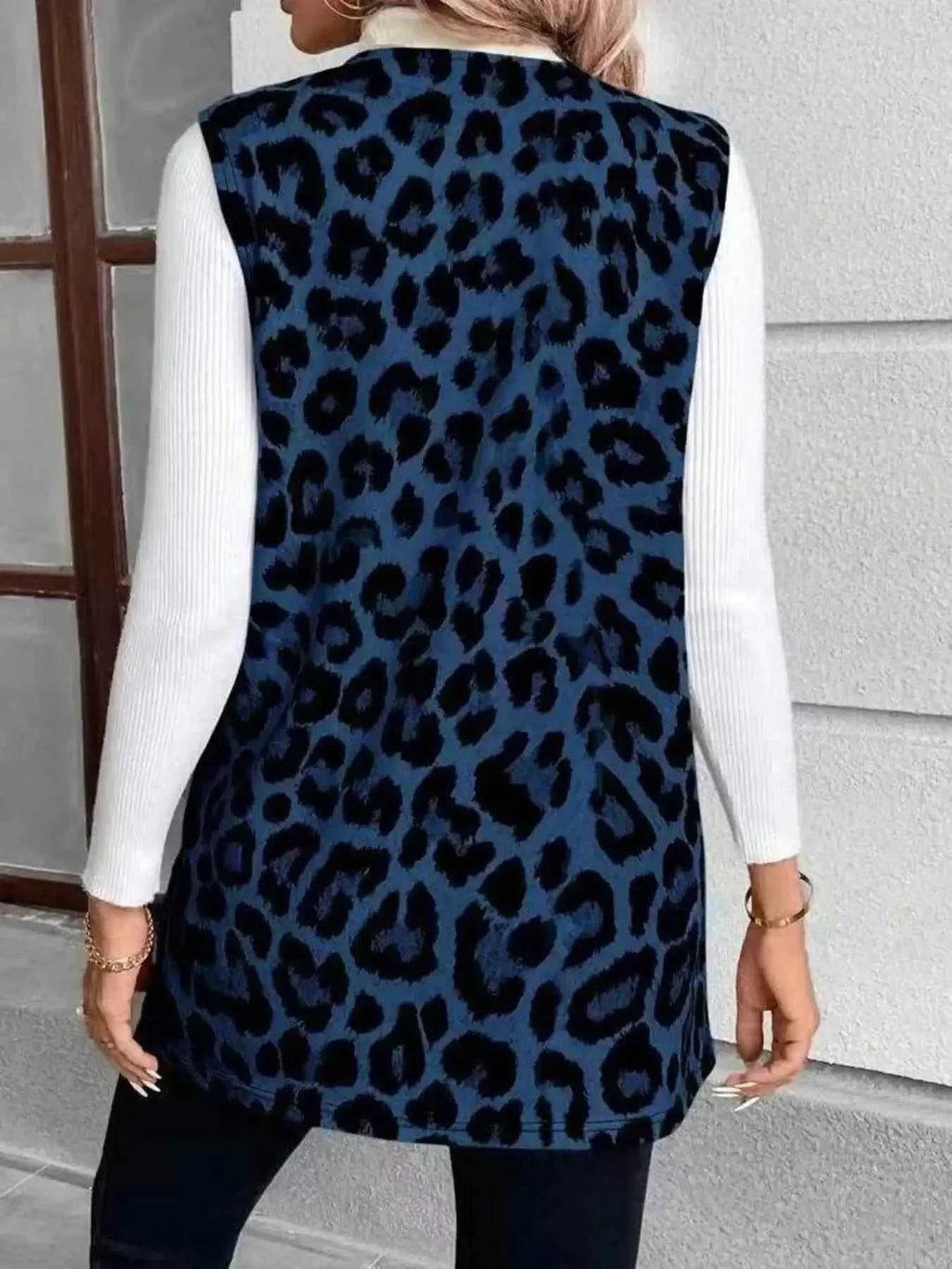 Sleeveless Leopard Print Vest in blue with black leopard spots, soft fabric, sleeveless design, casual fit
