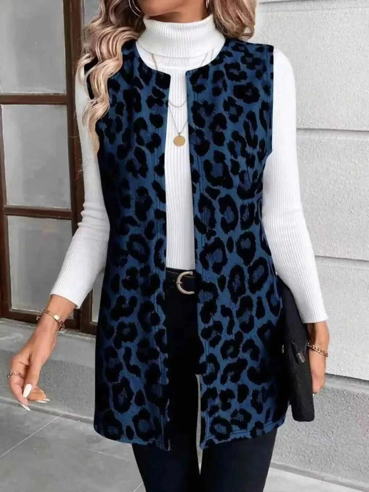 Sleeveless Leopard Print Vest in dark blue and black leopard pattern with round neckline and pocketed front