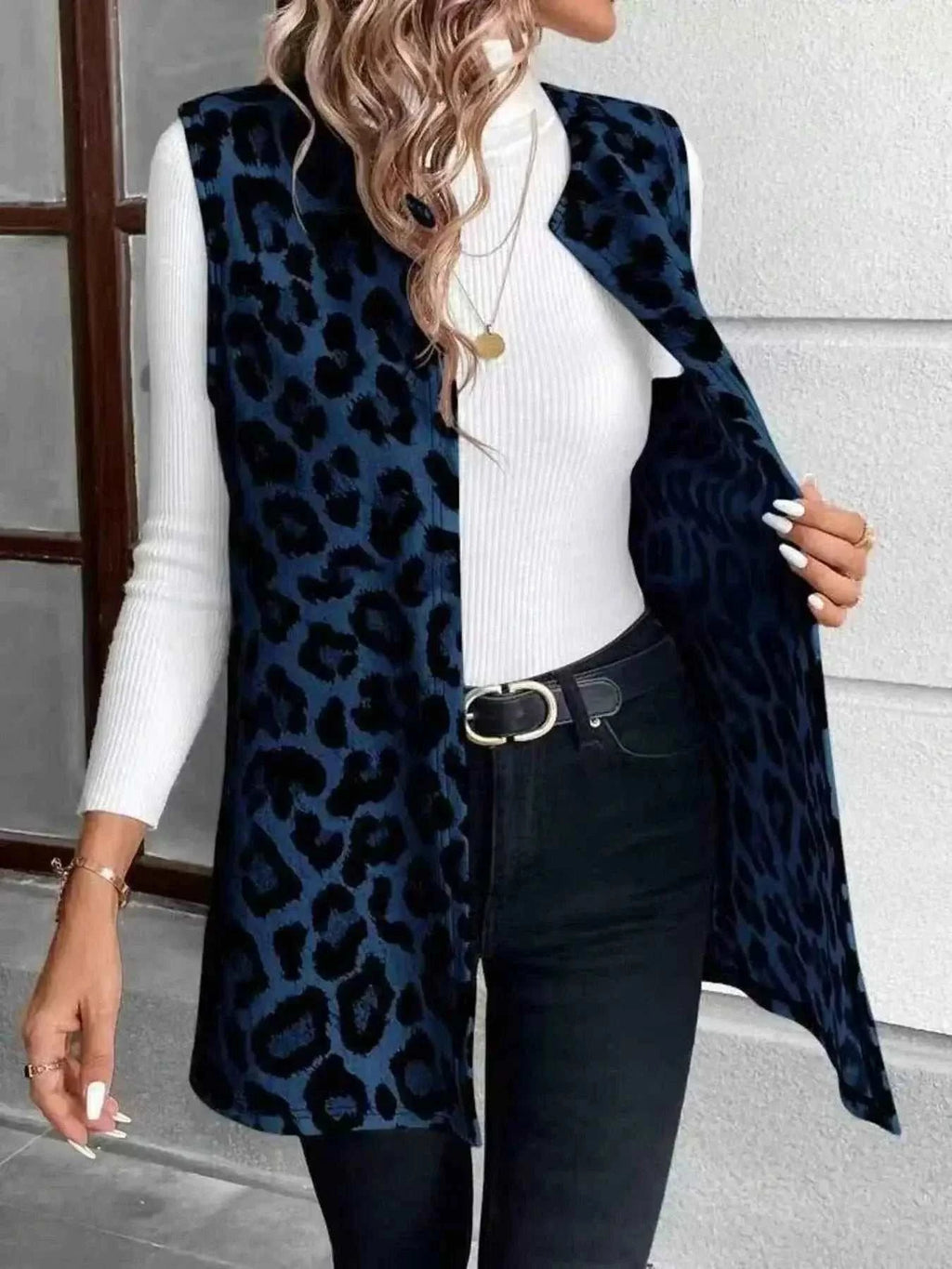 Sleeveless Leopard Print Vest in dark blue and black with leopard pattern, sleeveless design, and open front