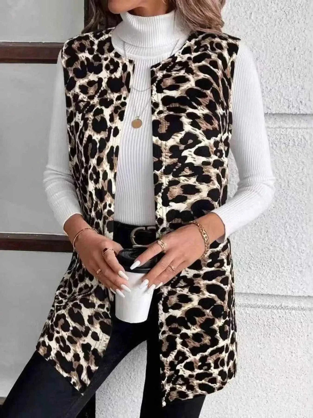 Sleeveless Leopard Print Vest with pocketed design, predominantly tan, black and brown leopard spots on polyester blend fabric