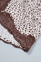 Slit Animal Print Skirt featuring white and brown animal print fabric with brown lace detail and a slit hem