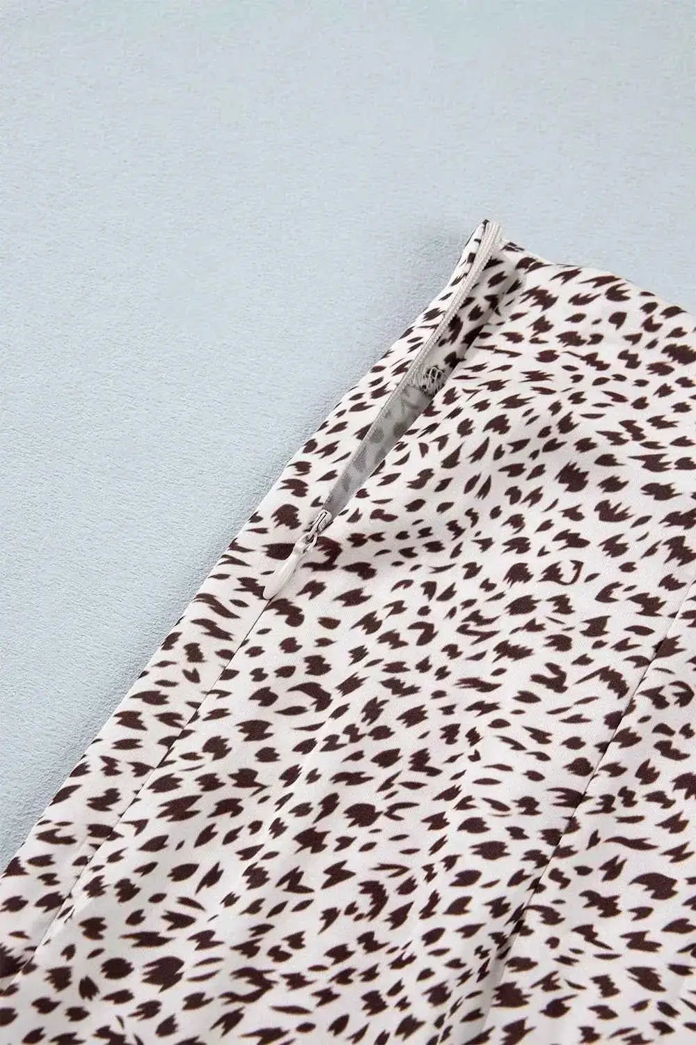 Slit Animal Print Skirt featuring a black and white abstract animal pattern with a visible side slit detail