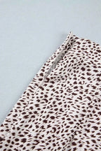 Slit Animal Print Skirt featuring a black and white abstract animal pattern with a visible side slit detail