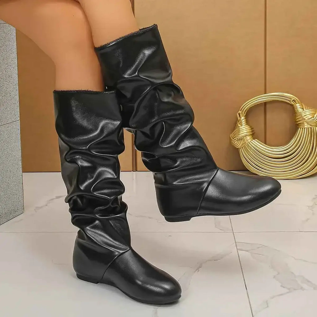 Slouchy Mid-Calf Boots in black PU leather with a rubber sole, featuring a flat heel and a wrinkled, relaxed shaft design.