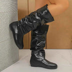 Slouchy Mid-Calf Boots in black PU leather with a slouched design, flat rubber sole, and mid-calf height.