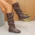 Slouchy Mid-Calf Boots in dark brown PU leather with a slouched design, flat rubber soles, and a rounded toe shape.