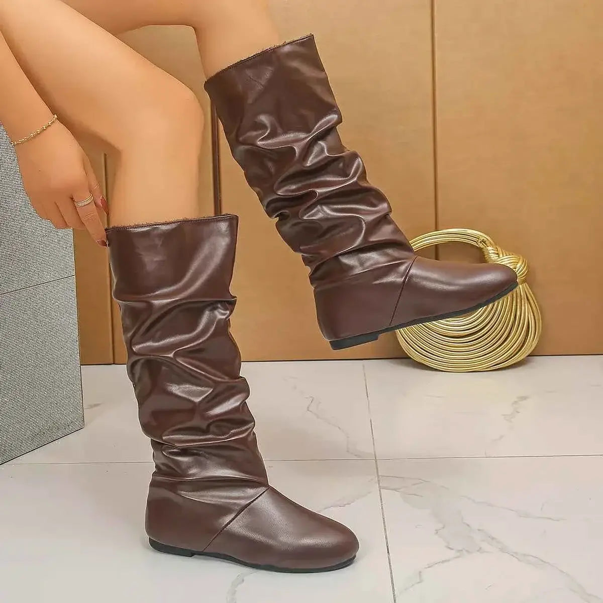 Slouchy Mid-Calf Boots in dark brown PU leather with a slouched design, flat rubber soles, and a rounded toe shape.