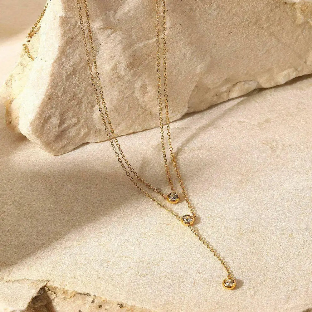 Elevate your style with the luxe zircon double-layered necklace $19.99 1-piece crafted from luxurious 18k gold-plated