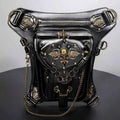 Small black PU leather crossbody bag with antique gold-tone spikes, rings, chain, and Steampunk Skull Decor accents in gothic style