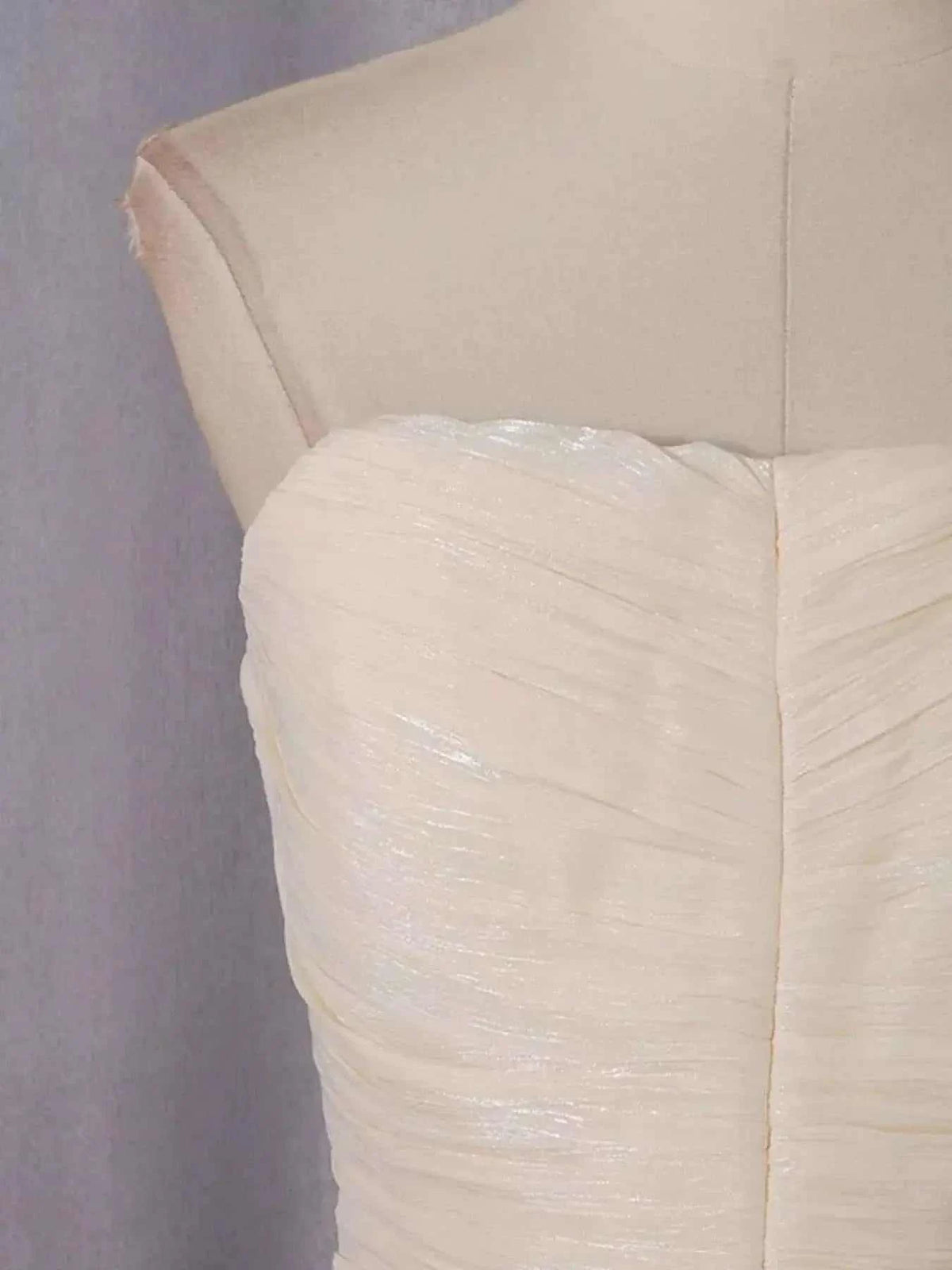 Strapless Ruffle Ruched Mini Dress in ivory polyester featuring ruched fabric and ruffle detailing on bust