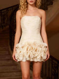 Strapless Ruffle Ruched Mini Dress in ivory polyester with a ruched bodice and layered ruffle hem detailing