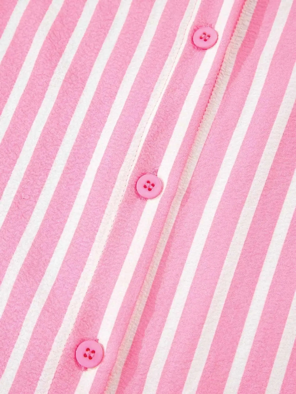 Pink and white stripe buttoned front top with round pink buttons in polyester fabric