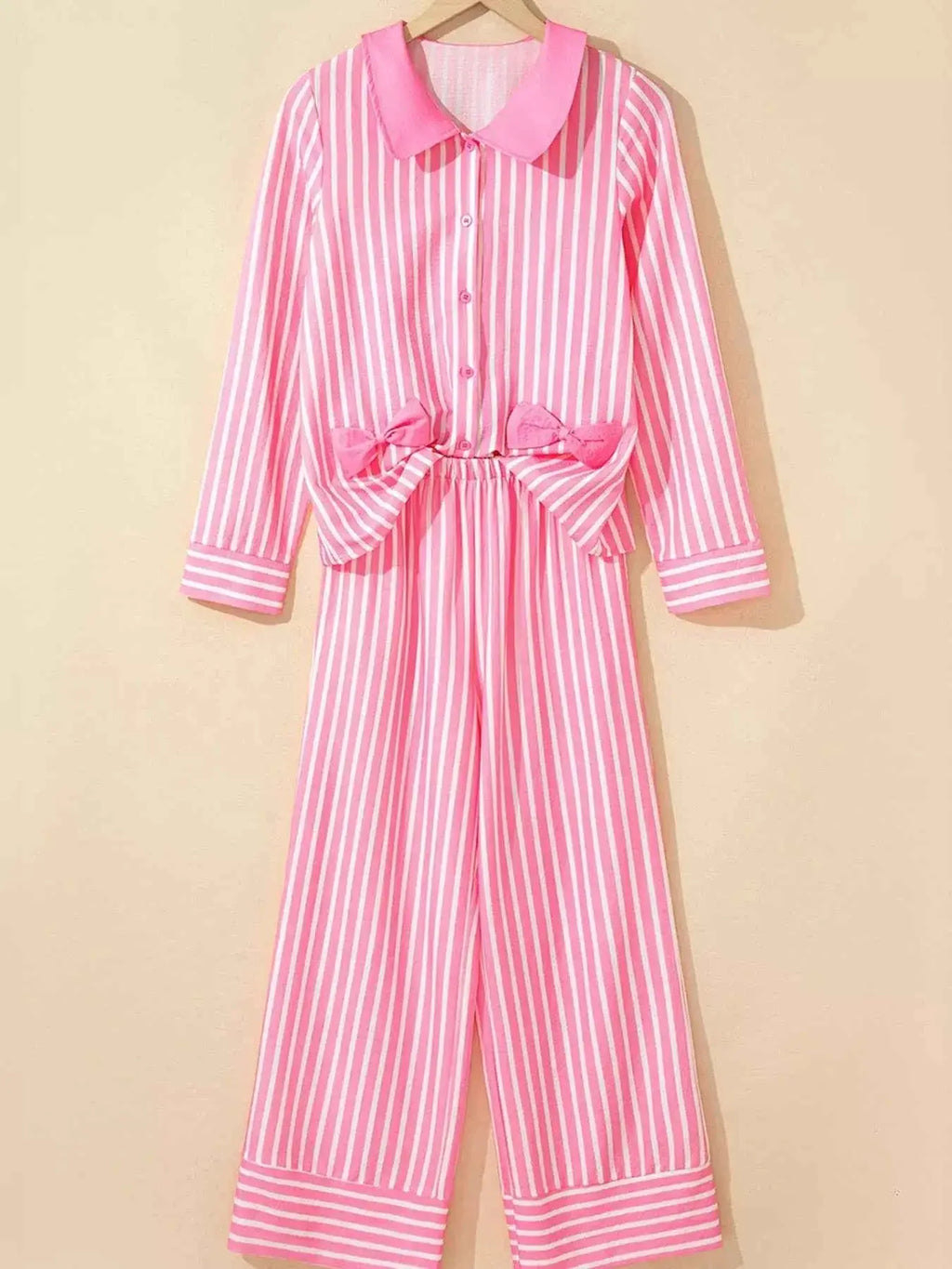 Stripe Buttoned Front two-piece sleepwear set in pink and white vertical stripes with long sleeves and bow detail