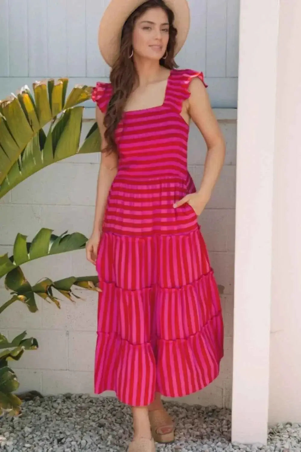 Stripe Flutter Sleeve smocked bodice tiered maxi dress in vibrant pink with horizontal stripes and ruffled flutter sleeves