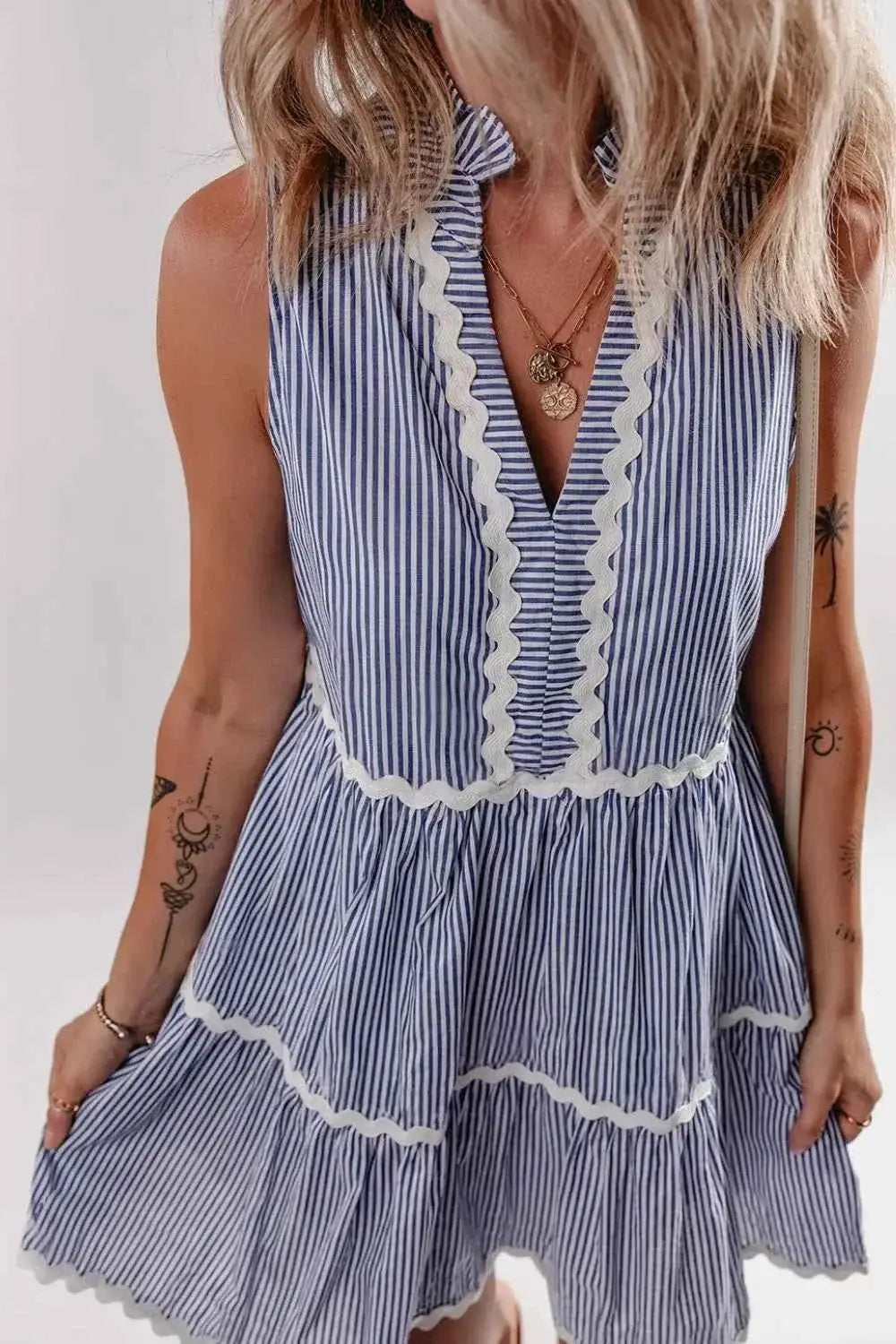 Stripe Sleeveless Notched Ric Rac Mini Dress in blue and white striped cotton with tiered frill details and white ric rac trim