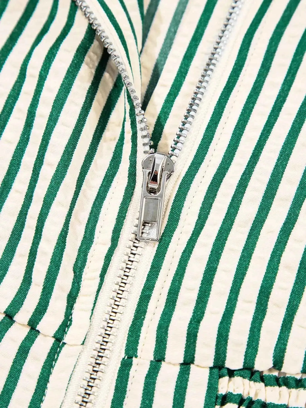 Stripe V Neck dress fabric with green and beige vertical stripes and a silver metal zipper front detail
