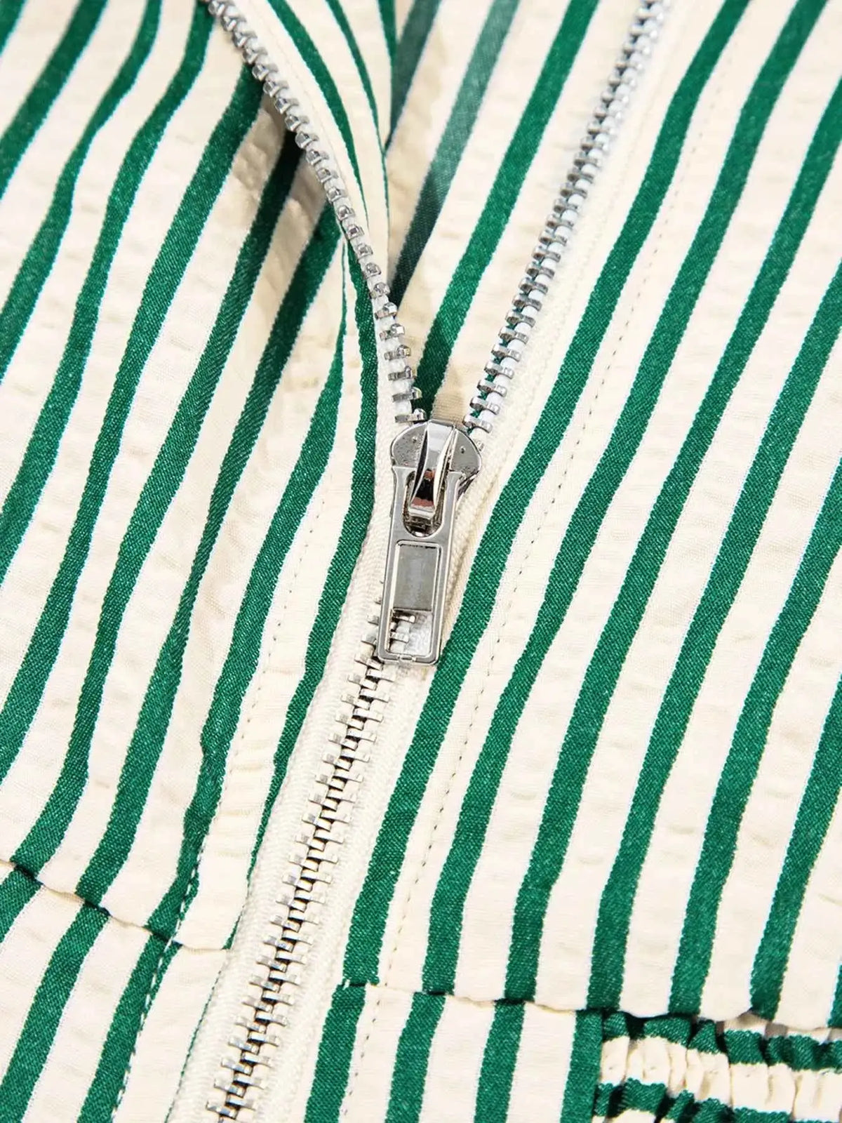 Stripe V Neck dress fabric with green and beige vertical stripes and a silver metal zipper front detail