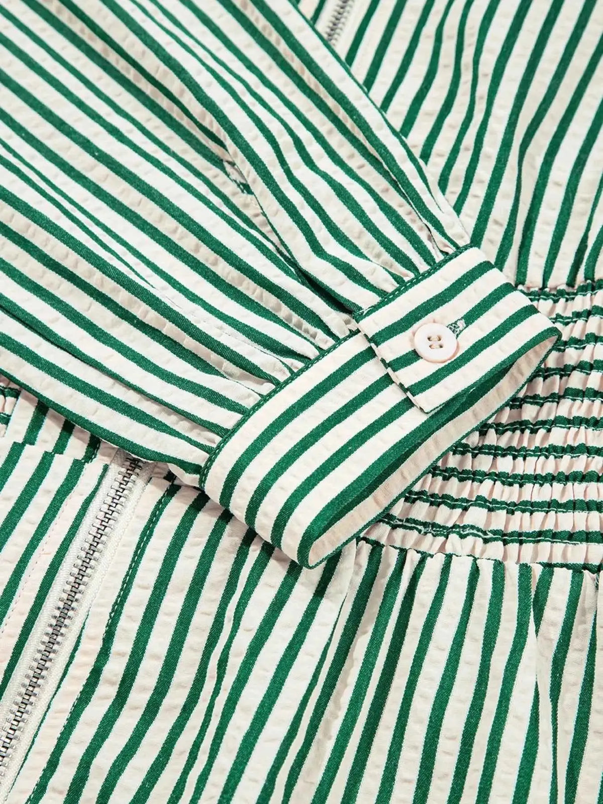 Stripe V Neck dress with green and white vertical stripes, buttoned cuff, zipper front, and cinched smocked waist detail