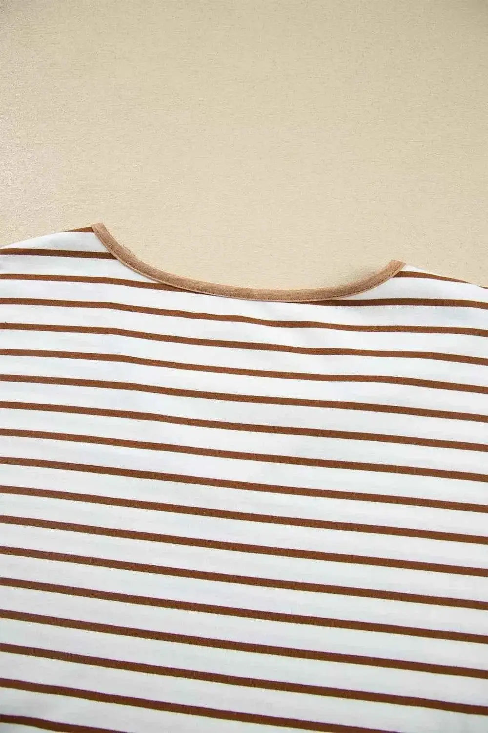 Stripe V Neck Ruffle top featuring white fabric with thin brown horizontal stripes and a brown trimmed scoop neckline