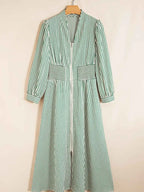 Stripe V Neck zip front midi dress with green and white vertical stripes, smocked waist, and long sleeves