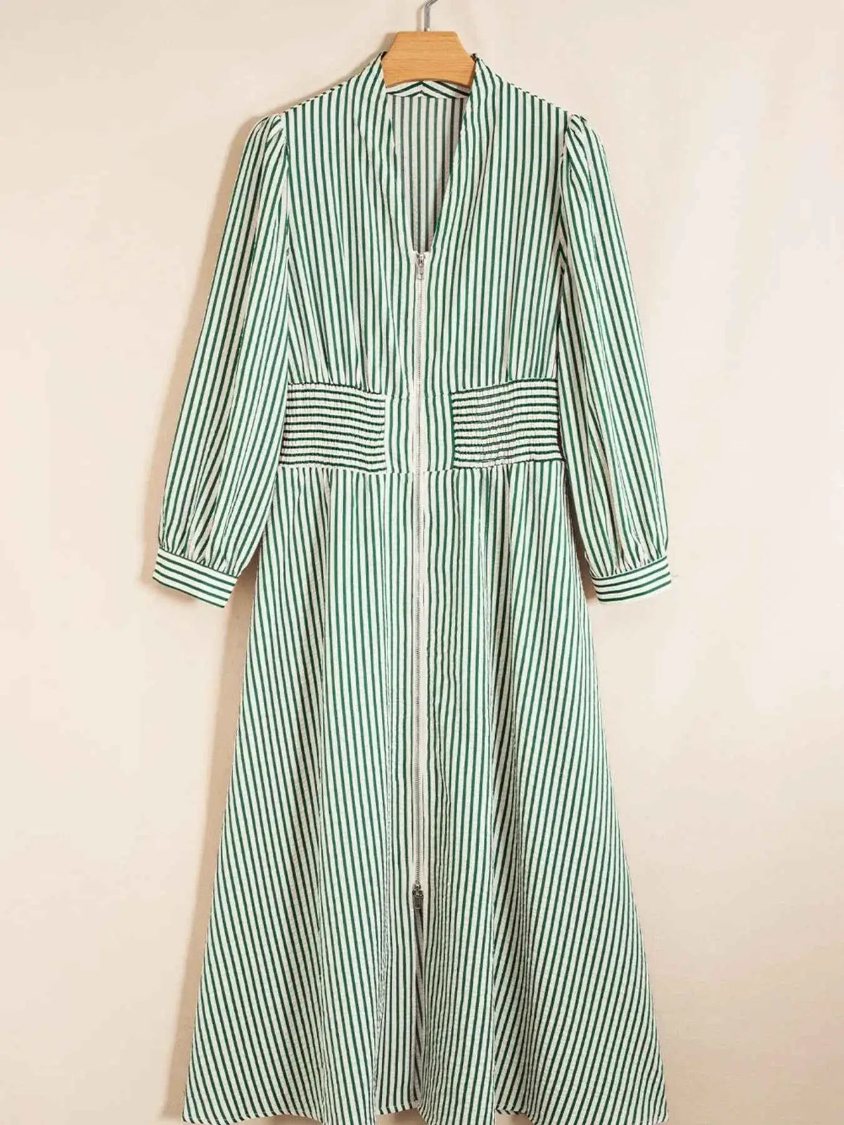 Stripe V Neck zip front midi dress with green and white vertical stripes, smocked waist, and long sleeves
