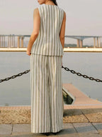 Striped Sleeveless V-Neck Top in vertical beige and white stripes worn with matching wide-leg pants in lightweight fabric