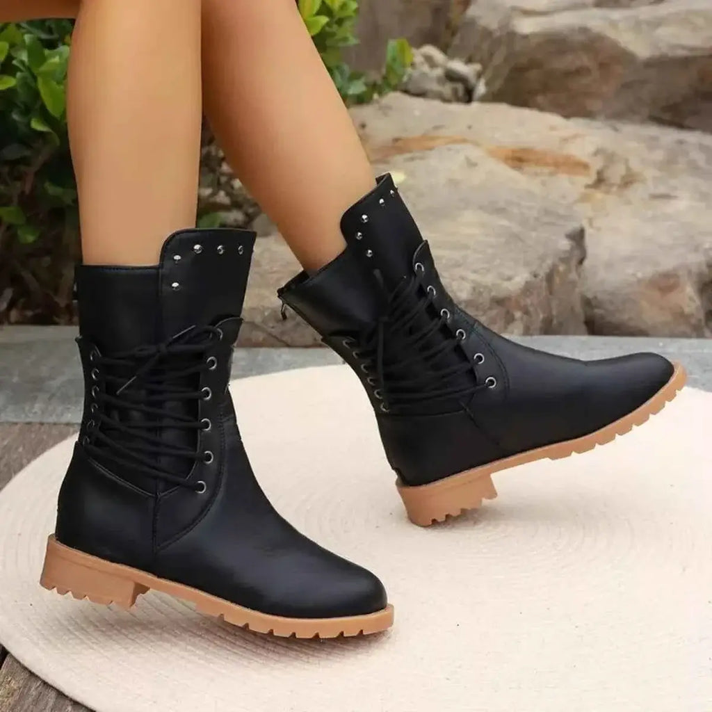 Studded Lace-Up Boots in black PU leather with silver studs and lace-up front, featuring tan rubber soles and mid heels.