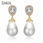 Stylish Teardrop Earrings with gold-tone setting, clear cubic zirconia accents, and white imitation pearl drops.