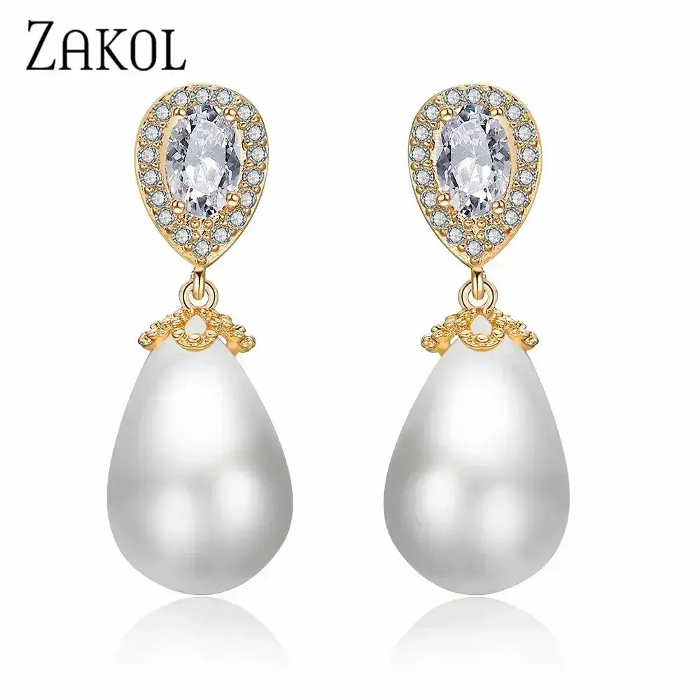 Stylish Teardrop Earrings with gold-tone setting, clear cubic zirconia accents, and white imitation pearl drops.