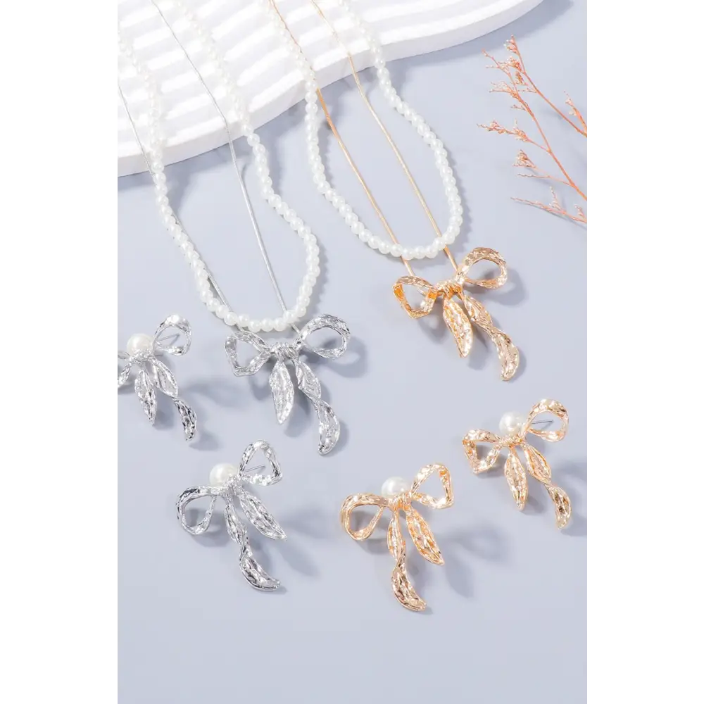 Luxury fashion for woman bow necklace and earring jewelry set $13.99 2-piece synthetic pearl, alloy care to maintain