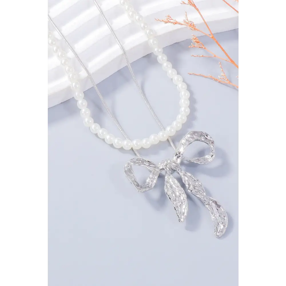 Luxury fashion for woman bow necklace and earring jewelry set $13.99 2-piece synthetic pearl, alloy care to maintain