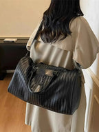 Textured Leather Travel Bag in black PU leather with woven pattern, large size, featuring dual handles and shoulder strap