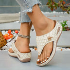 Toe Post Wedge Sandals in beige PU leather with a croc pattern and mid rubber wedge heel, featuring a toe post design