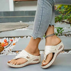 Toe Post Wedge Sandals in beige PU leather with a textured pattern and mid-height platform wedge soles worn with jeans