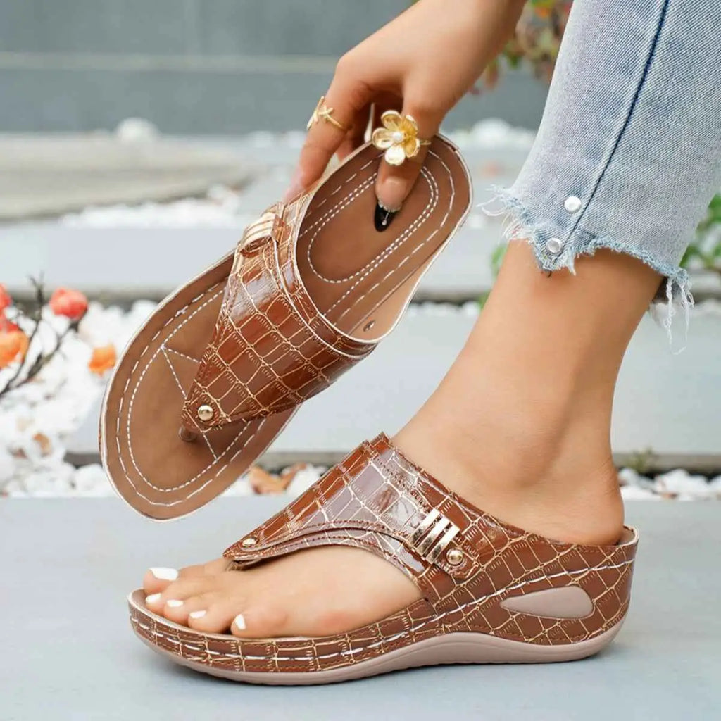 Toe Post Wedge Sandals in brown PU leather with crocodile pattern and mid height wedge rubber sole
