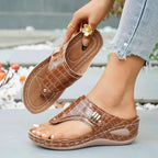 Toe Post Wedge Sandals in brown PU leather with crocodile pattern and mid height wedge rubber sole